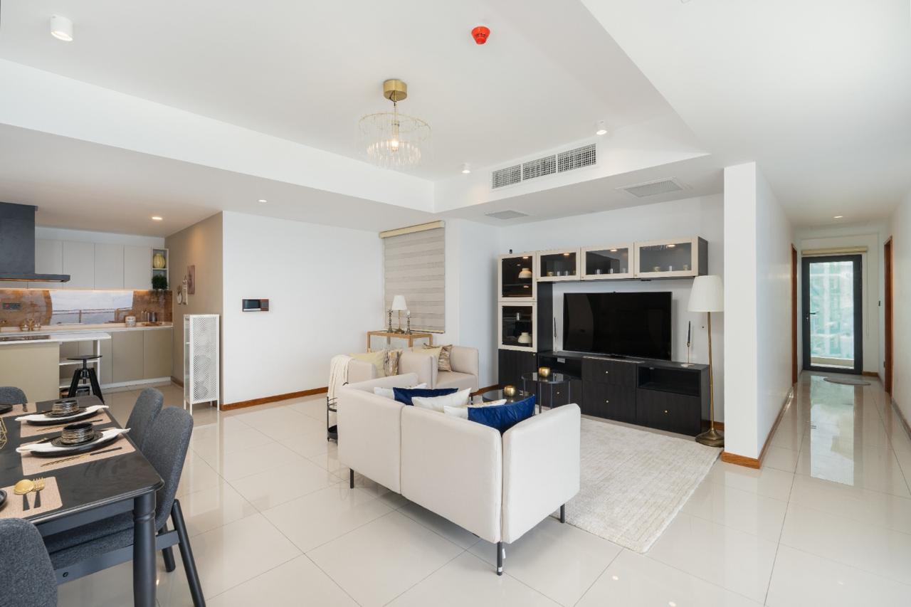 Living and dining space with ocean-facing balcony